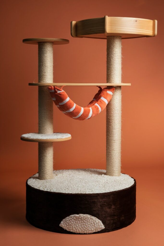 Shrimp sushi hammock cat tree with pink-orange plush – cute and functional design for playful cats.