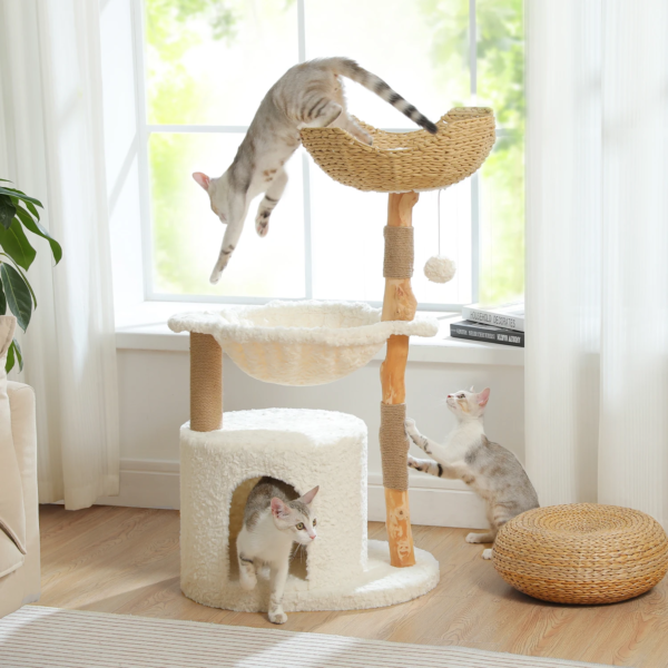 Handcrafted cat furniture for boho interiors featuring large wicker bed and plush hammock