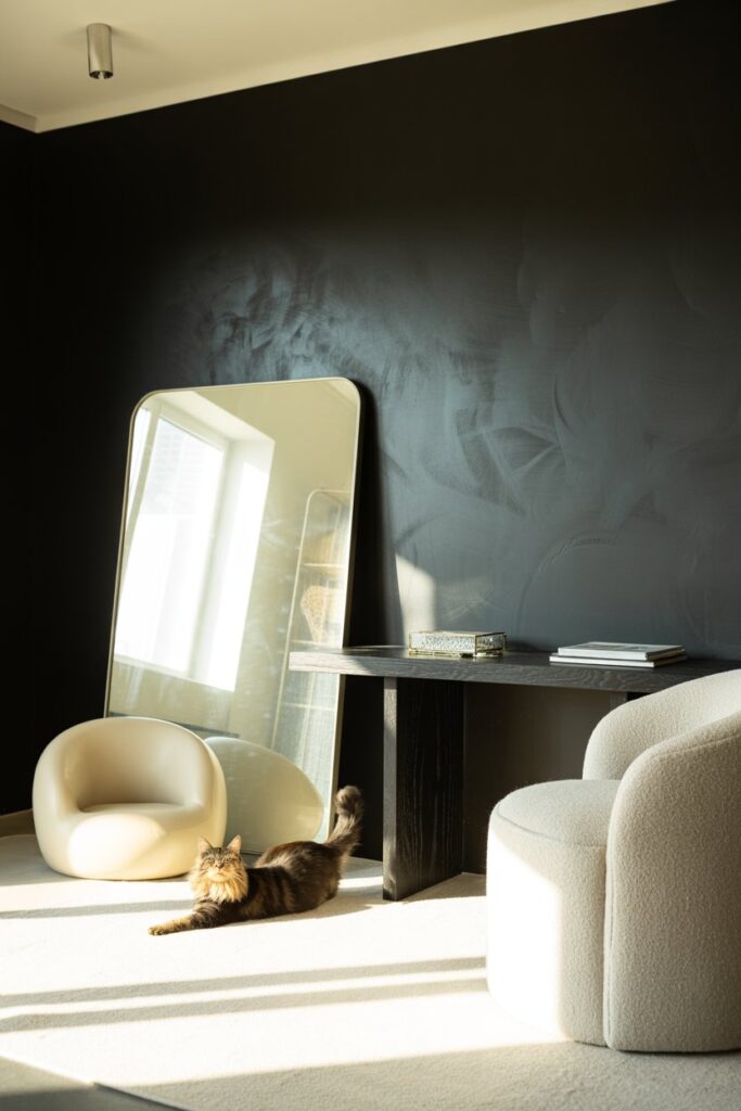 Stylish dark home decor with semi-gloss walls and mirror placement that brightens the space.